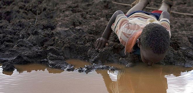 Kid Drinking Ground Water